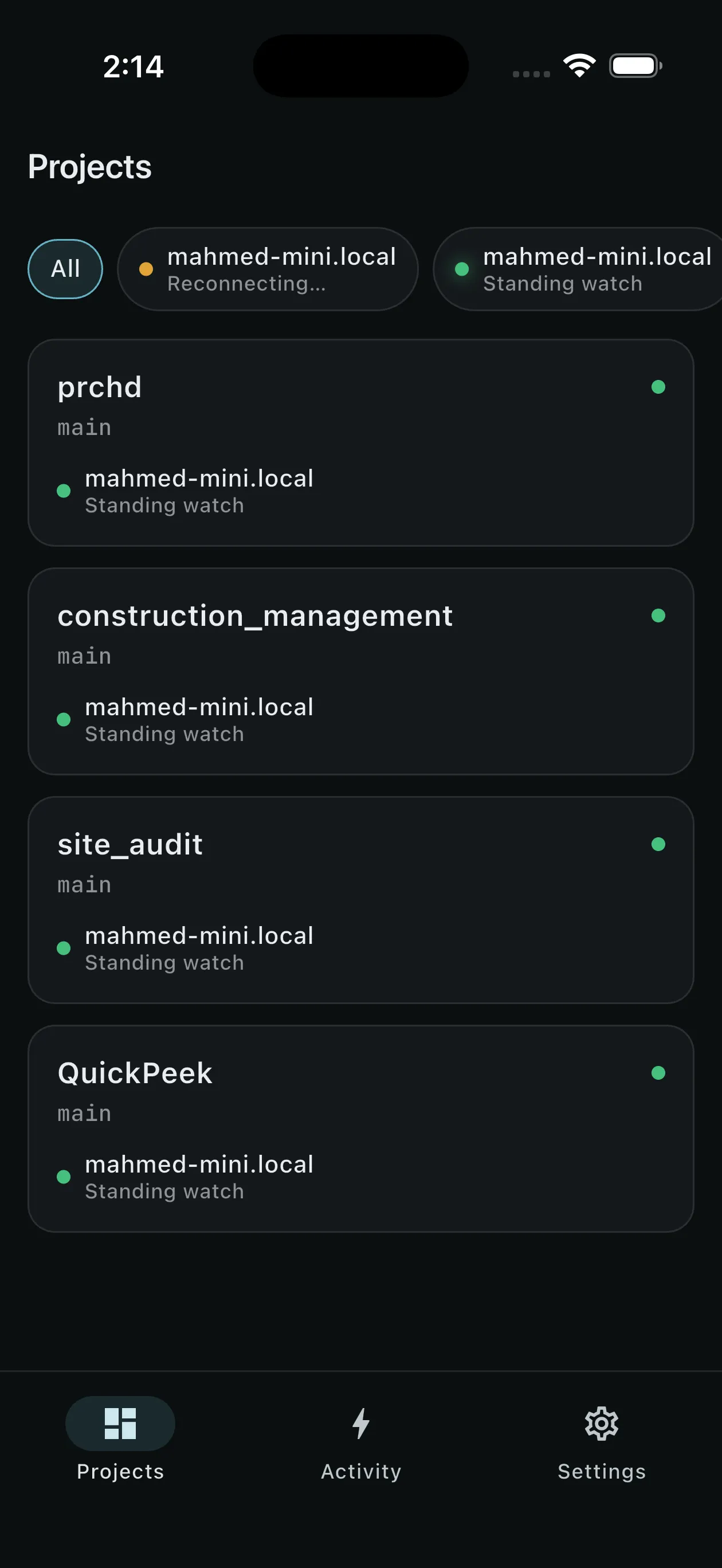 Projects from two paired Macs with host chips and status beacons